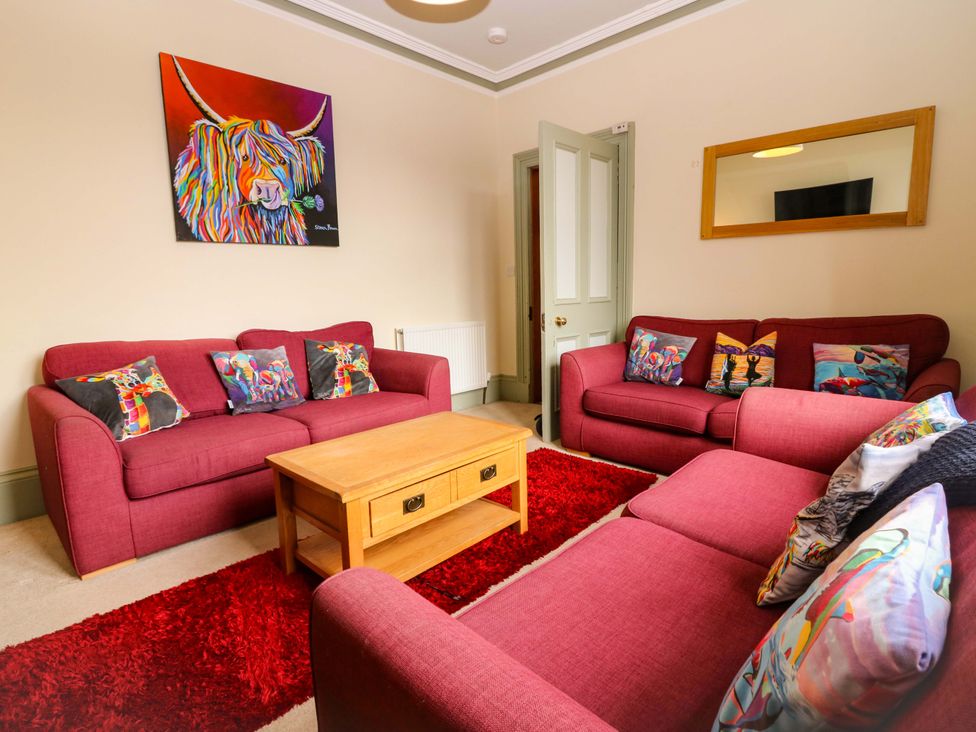 A living room with couches and a coffee table at Tayview in Killin