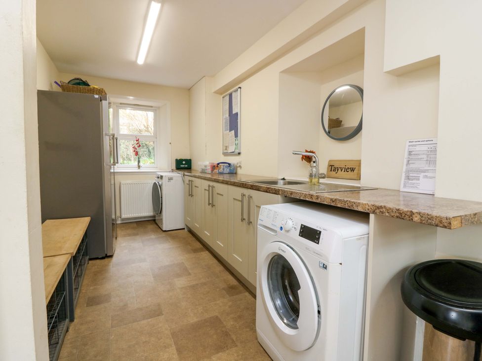 A utility room with appliances and countertop at Tayview in Killin