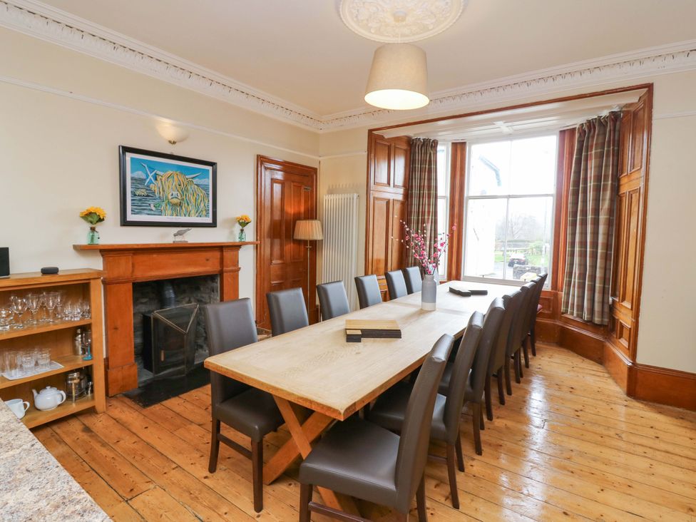 A dining room with a large table and chairs at Tayview in Killin