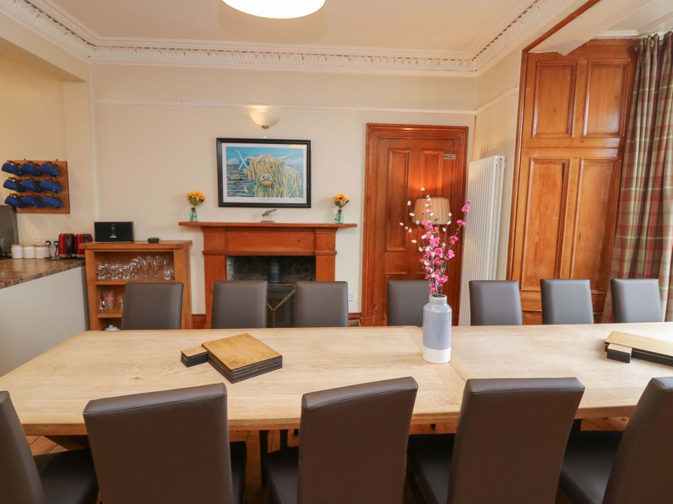 A dining room with a table and chairs at Tayview in Killin