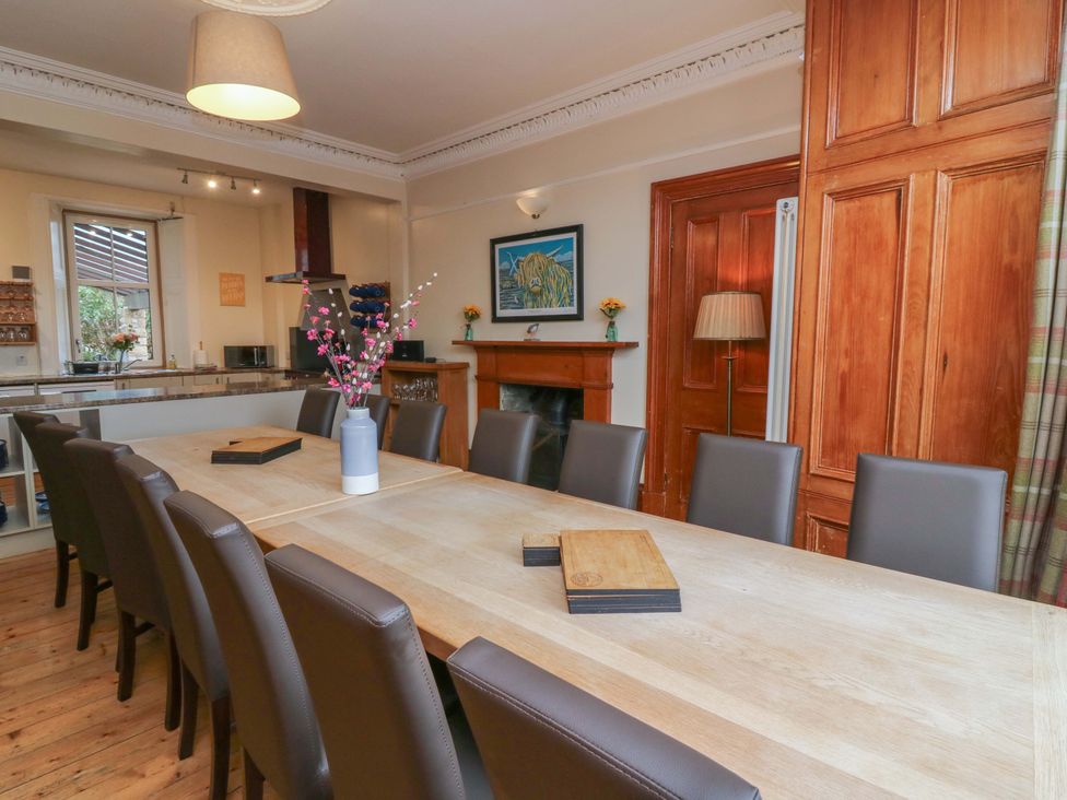 A dining room with a large table and chairs at Tayview in Killin