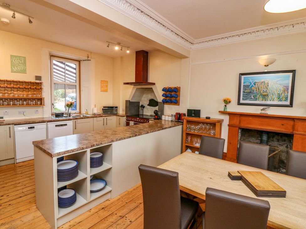 A kitchen with a dining table and chairs at Tayview in Killin