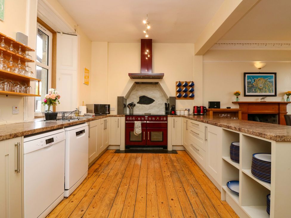 A kitchen featuring an oven and dishwasher at Tayview in Killin
