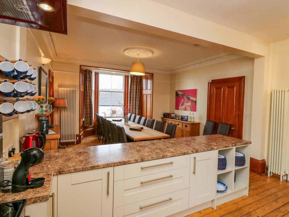 A kitchen with dining table and chairs at Tayview in Killin