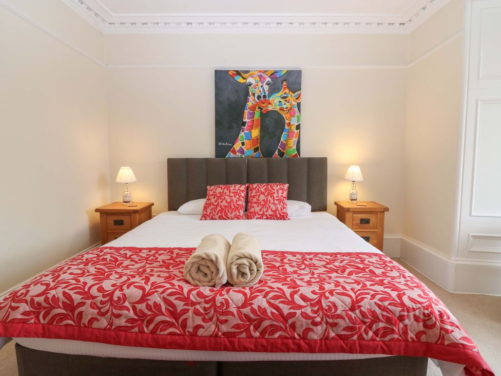 A bedroom with a bed and lamps at Tayview in Killin