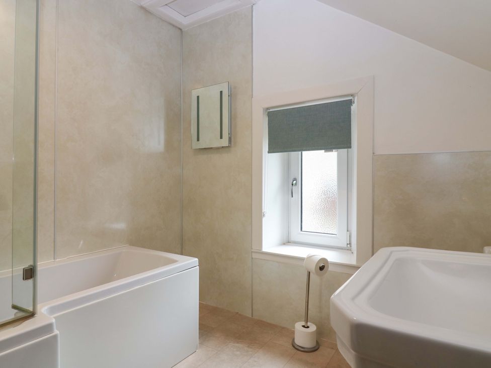 A bathroom with a bathtub and a shower at Tayview in Killin