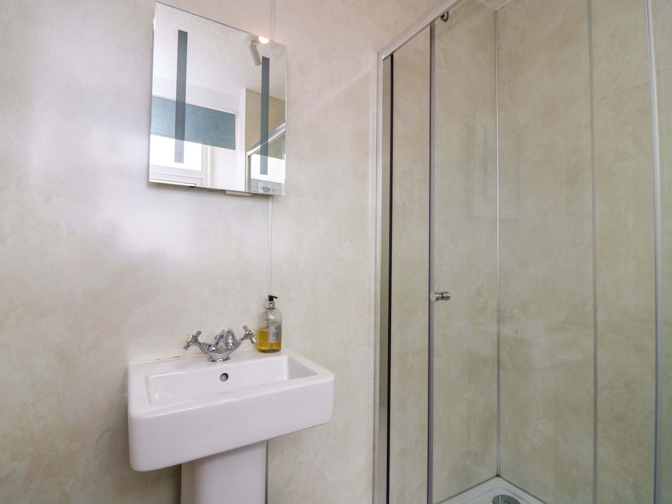 A bathroom with a sink and shower at Tayview in Killin