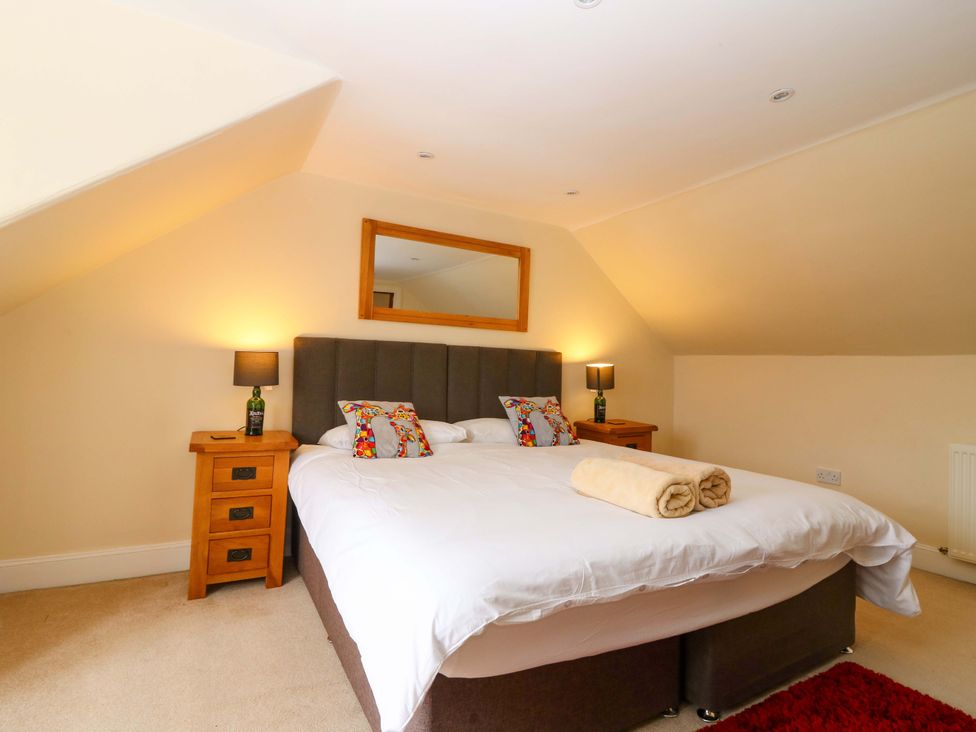 A bedroom with a double bed and bedside tables at Tayview in Killin