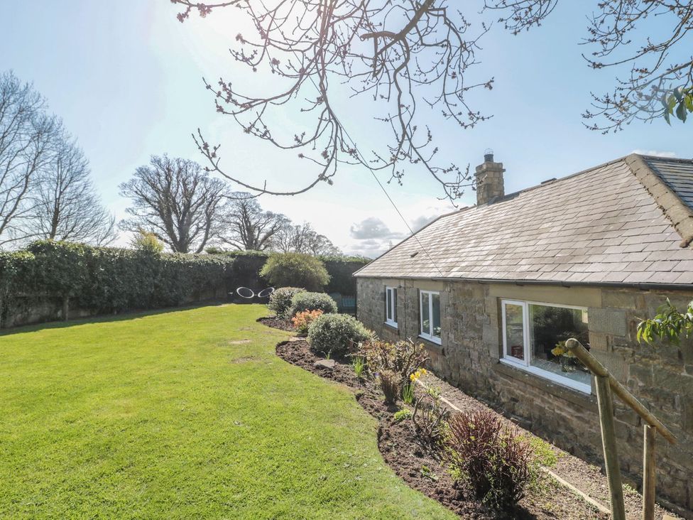 A house with a garden and trees at Whinney Moor in 