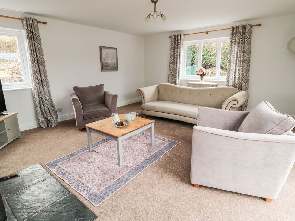 A living room with sofas and a coffee table at Whinney Moor