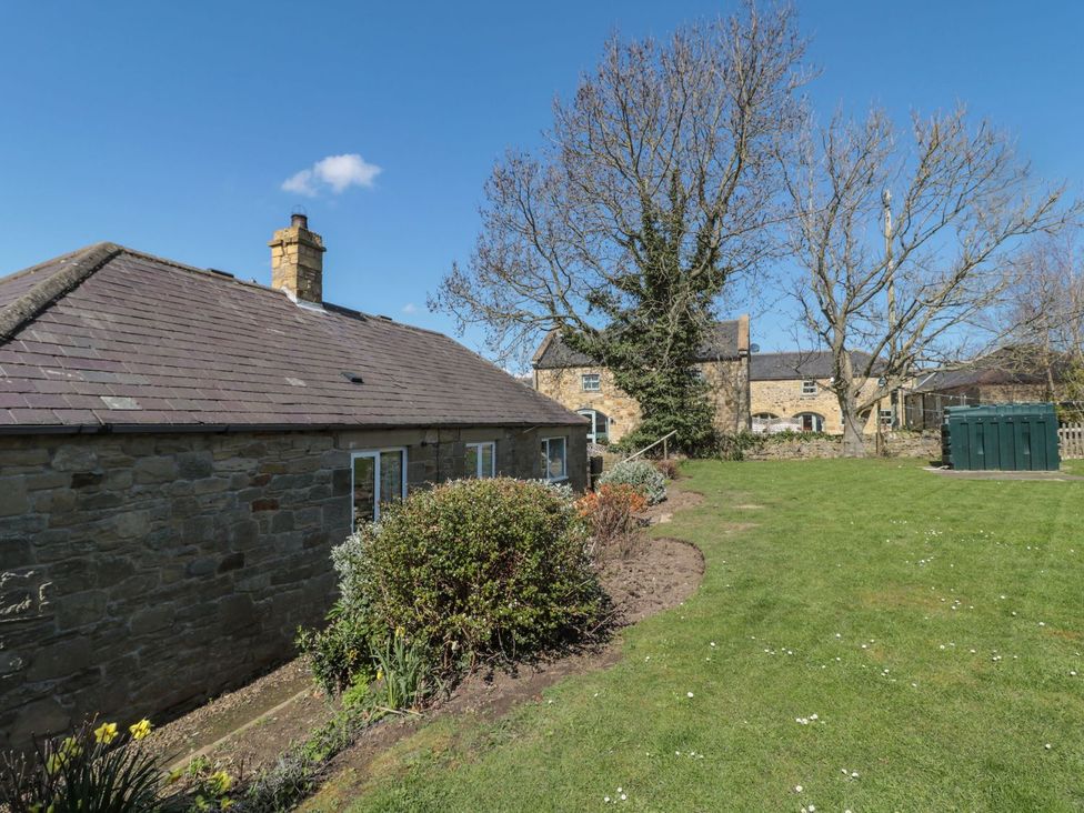 An outdoor view of a house with garden at Whinney Moor in 