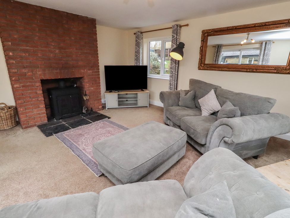 A living room with a sofa and television at Whinney Moor in Alnwick