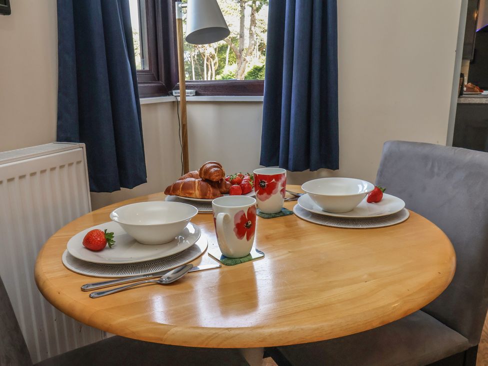 A dining table set with bowls, cups, and croissant at Bugle Saltburn-By-The-Sea