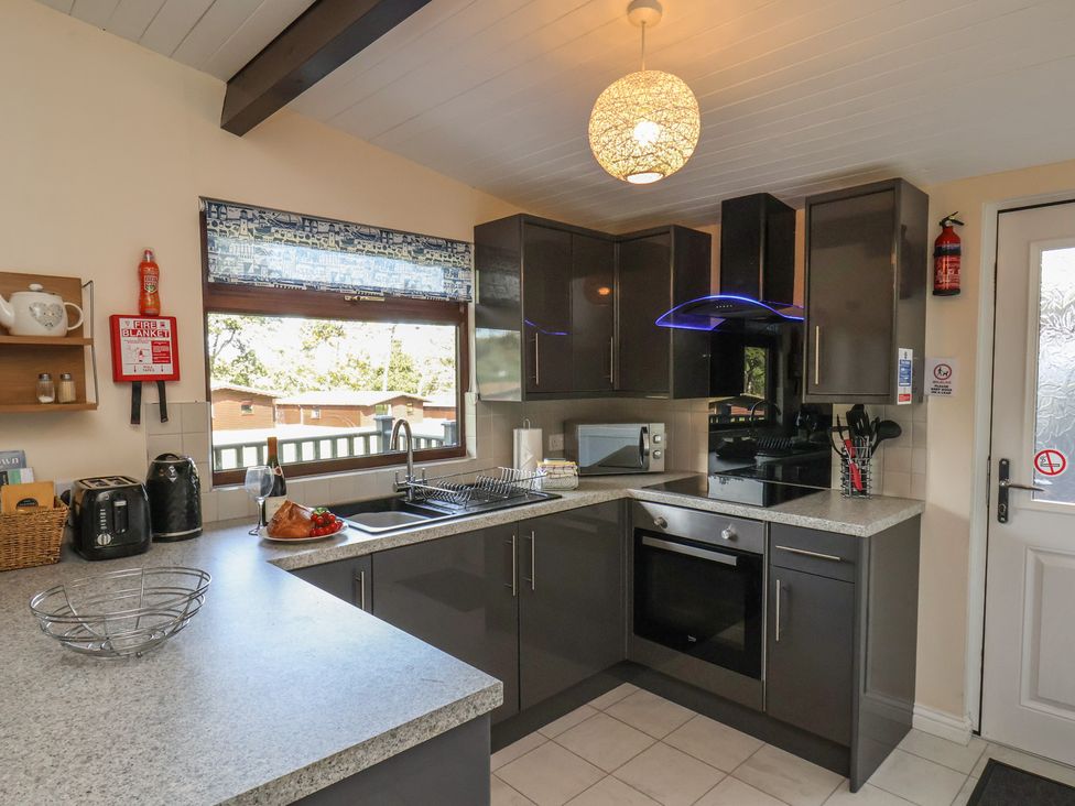 A kitchen with modern appliances and a sink at Bugle Saltburn-By-The-Sea