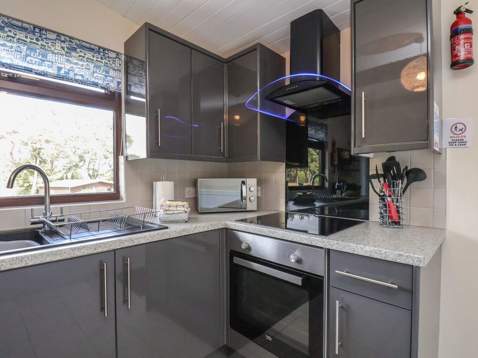 A kitchen with cabinets, sink, microwave, and stove at Bugle in Saltburn-By-The-Sea