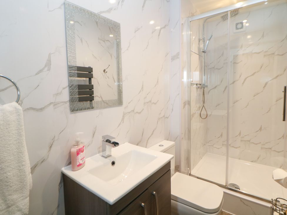 A bathroom with a shower and sink at The Old Post Office in Wirksworth