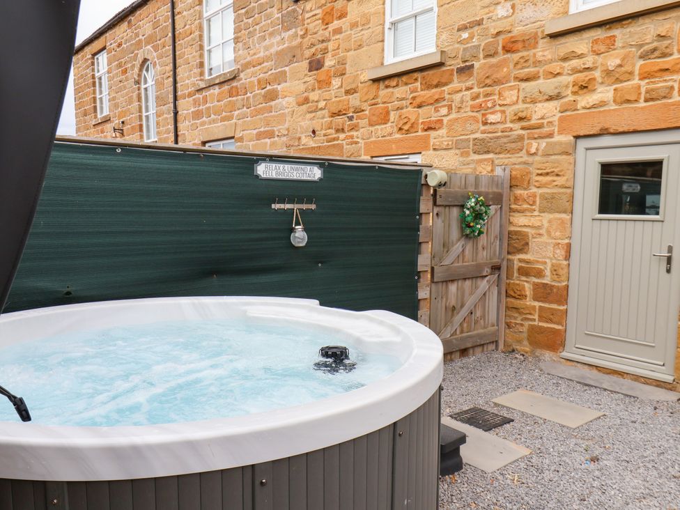 A hot tub in a gravel area at Fell Briggs Cottage Marske-By-The-Sea