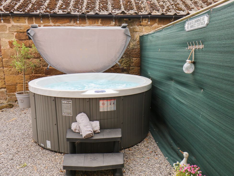 A hot tub with towel and steps at Fell Briggs Cottage in Marske-By-The-Sea