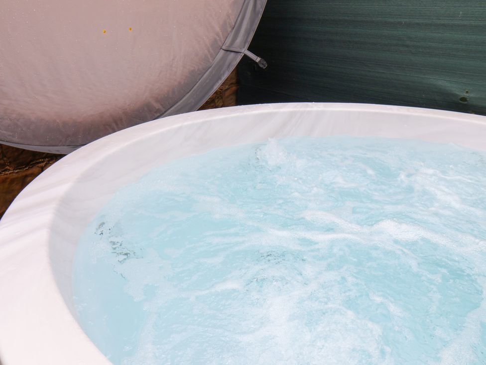 A hot tub with water and bubbles at Fell Briggs Cottage Marske-By-The-Sea