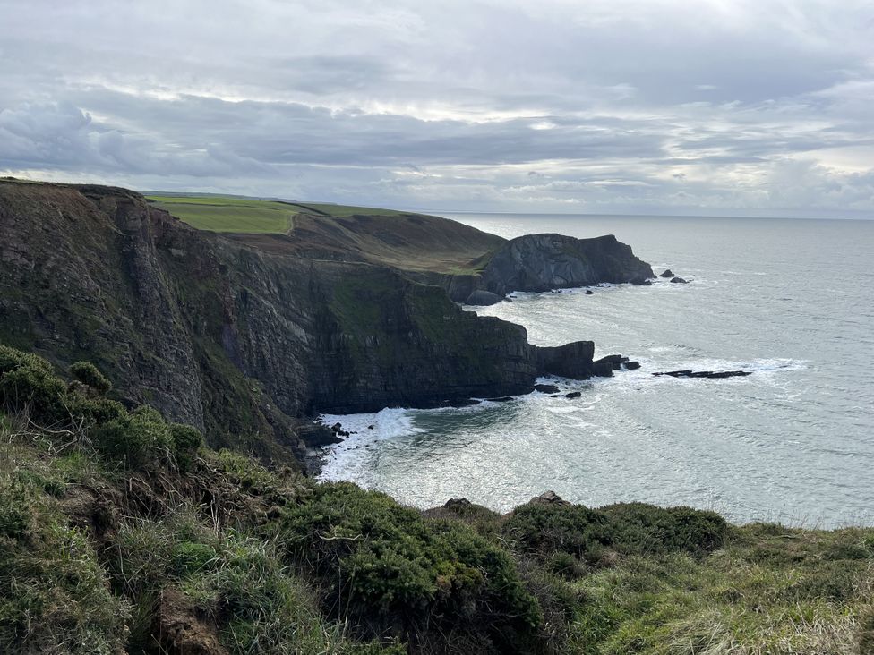 A view of coastal cliffs and ocean at The Hawthorns in North Molton