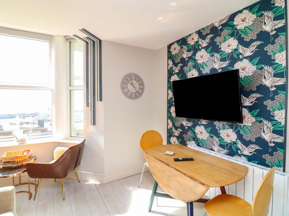 A dining room with a table and chairs at Apt 4 @ Hunter's Quay in Bridlington