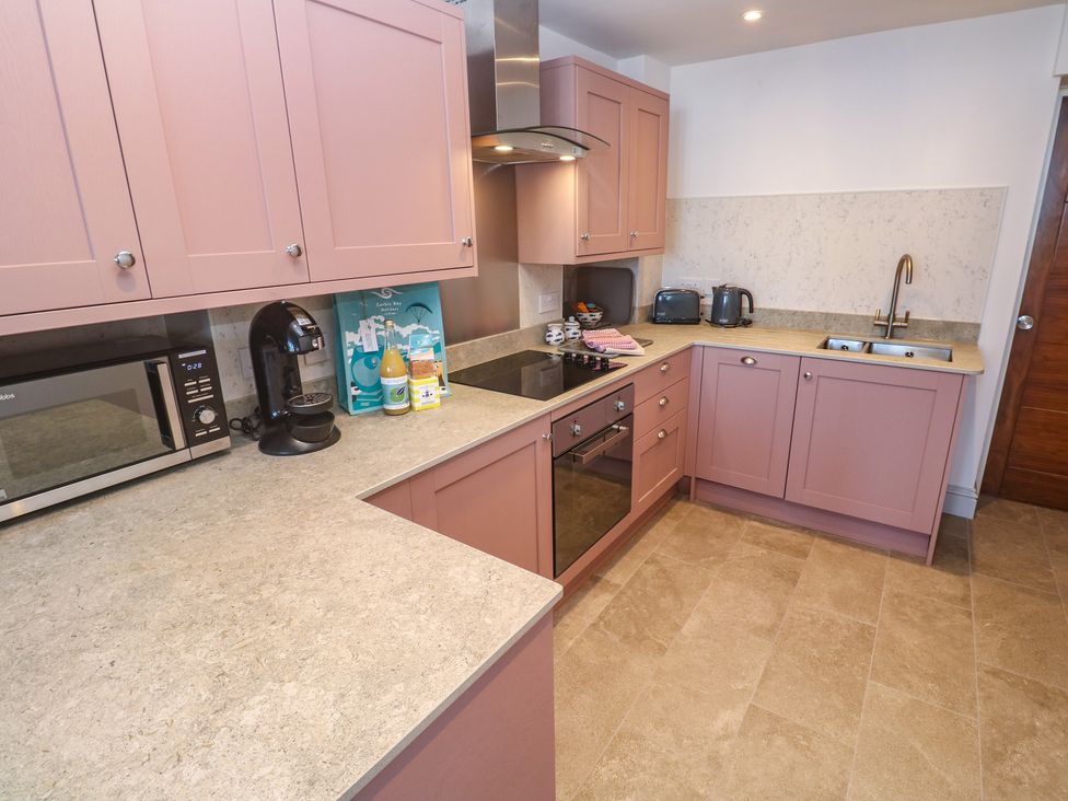 A kitchen with appliances and counters at Heron in St Ives
