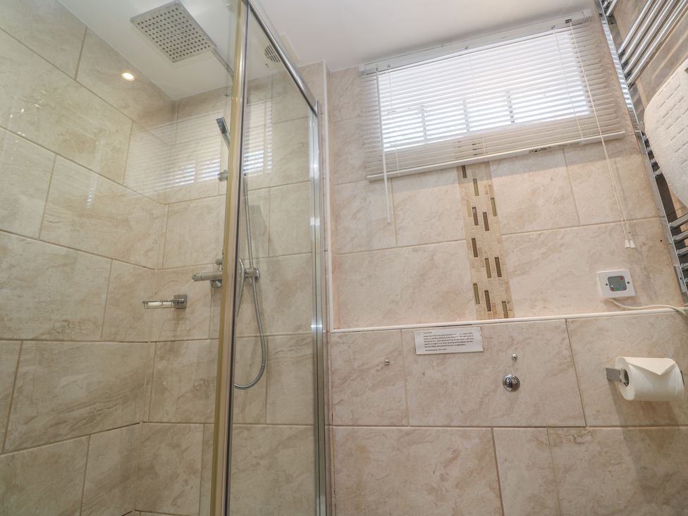 A bathroom with a shower and toilet at Heron St Ives