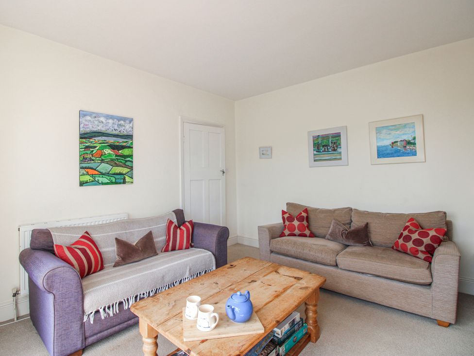 A living room with sofas and a coffee table at Eddystone in Hope Cove