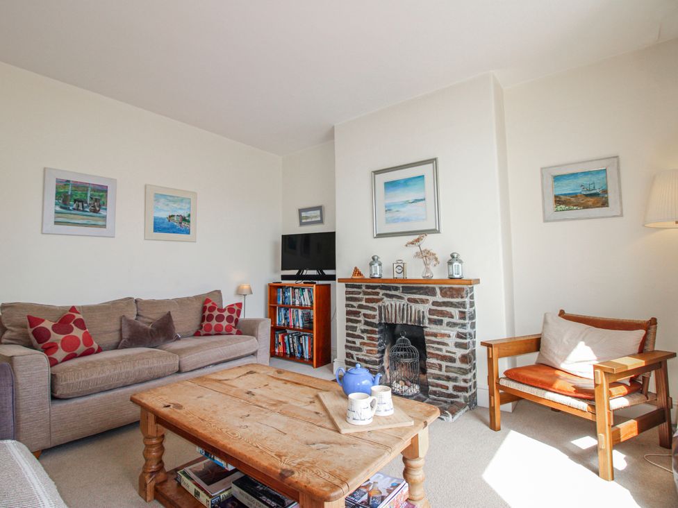 A living room with a sofa and coffee table at Eddystone in Hope Cove