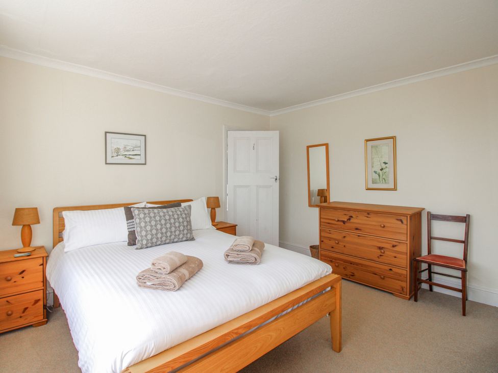 A bedroom with a bed and furniture at Eddystone in Hope Cove