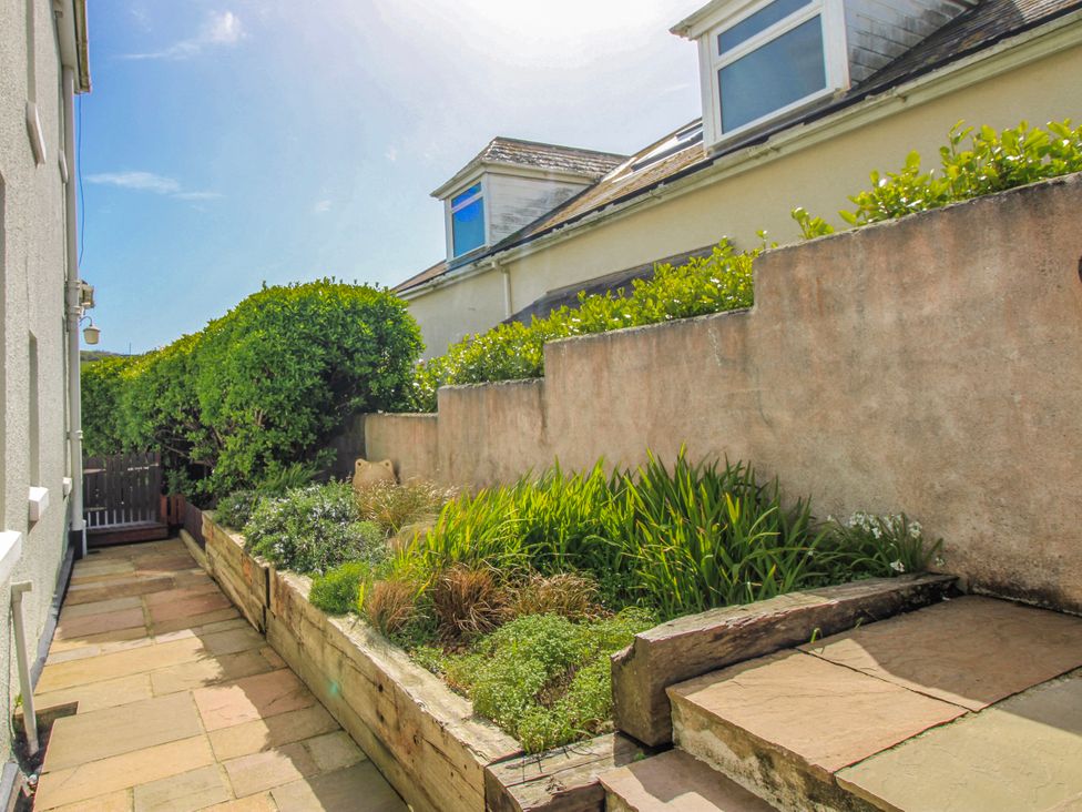 A garden with stone steps and plants at Eddystone Hope Cove