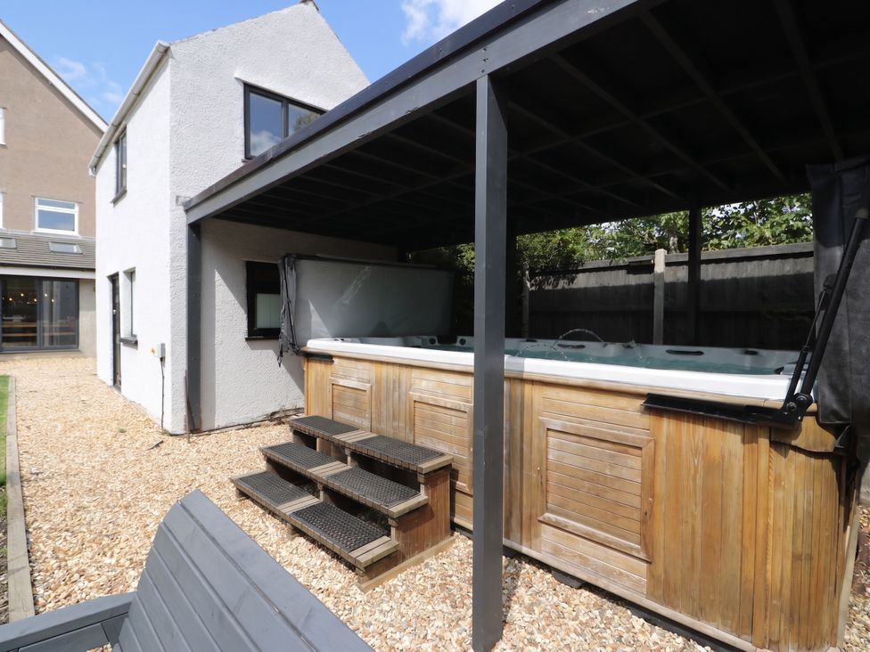 An outdoor area with a hot tub and steps at Cabin Hill, Rhos-On-Sea