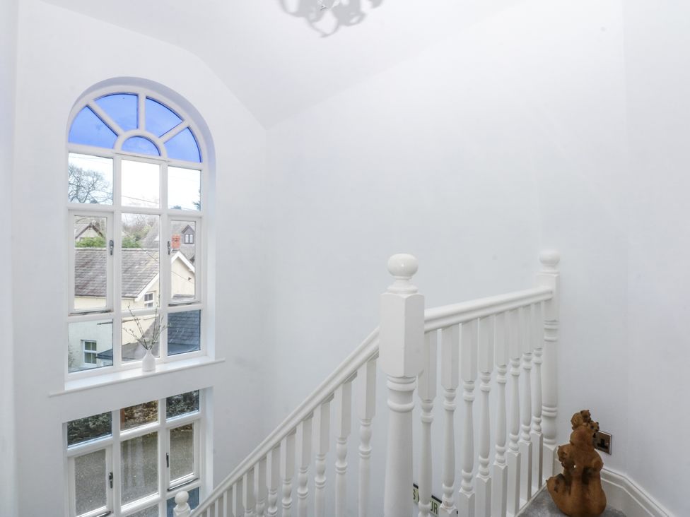 A staircase with a window and decorative object at Capel Y Ffynnon near Llandudno Junction