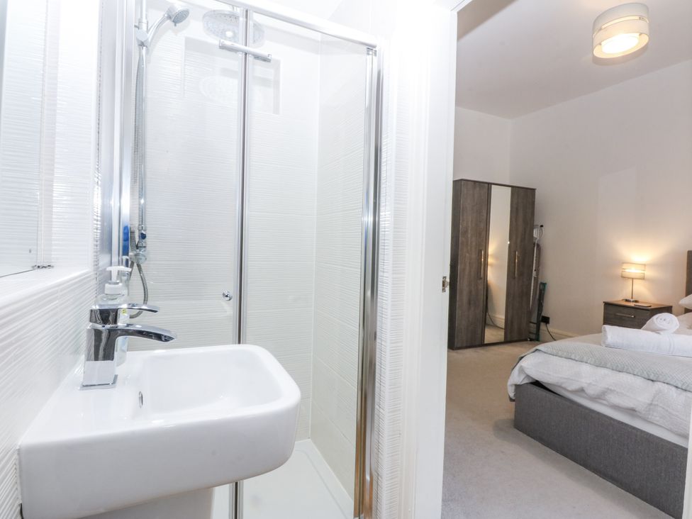 A bathroom with a shower and sink at Capel Y Ffynnon near Bryan Pardew Llandudno Junction