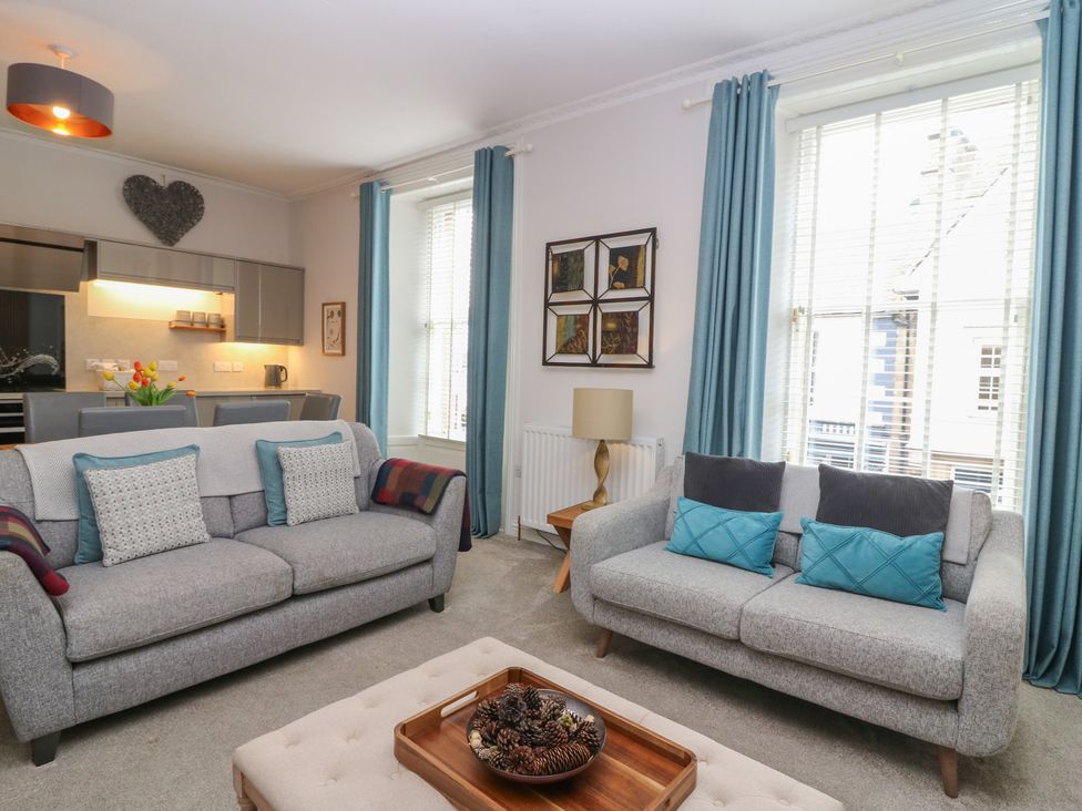 A living room with sofas and a coffee table at 2 Abbey Row in Kelso