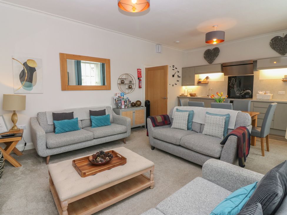 A living room with sofas and a coffee table at 2 Abbey Row in Kelso