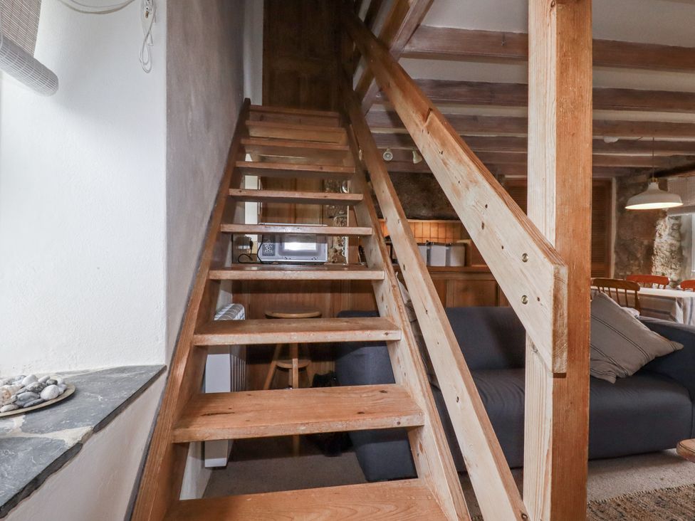 A staircase leading up in a living room at 3 The Green