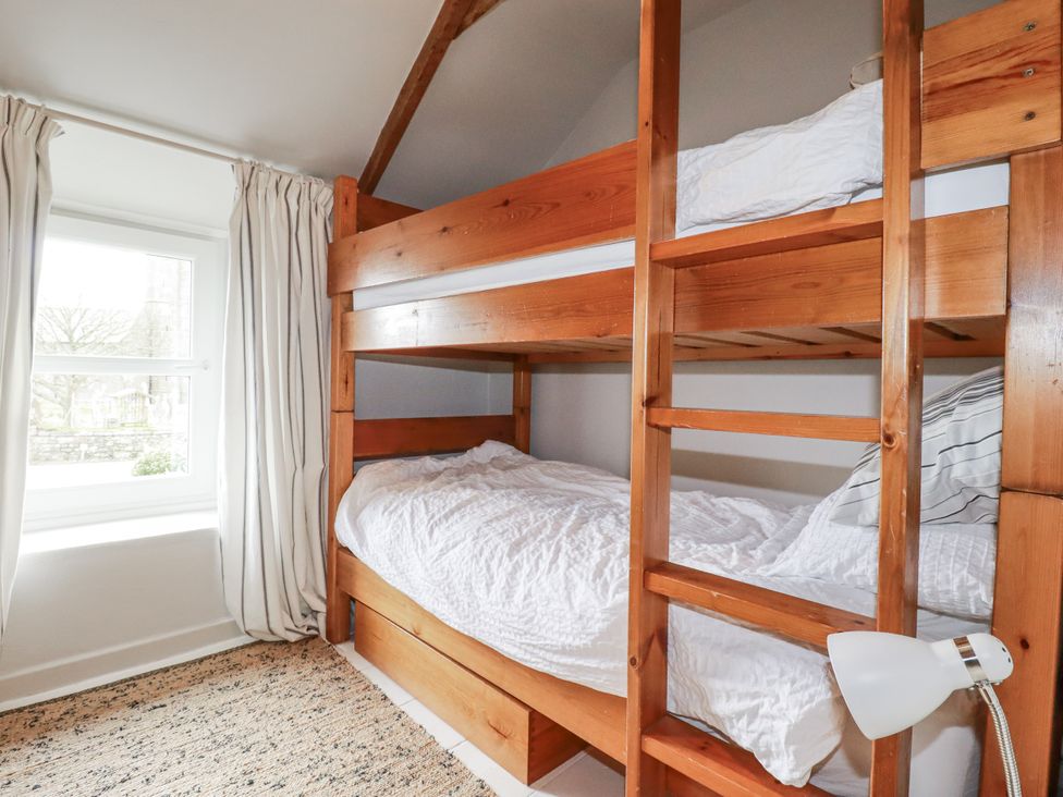 A bedroom with a bunk bed and a window at 3 The Green