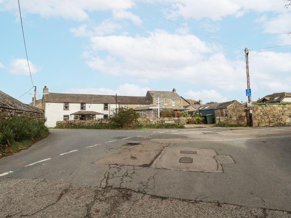 A street view featuring houses and a road at 3 The Green