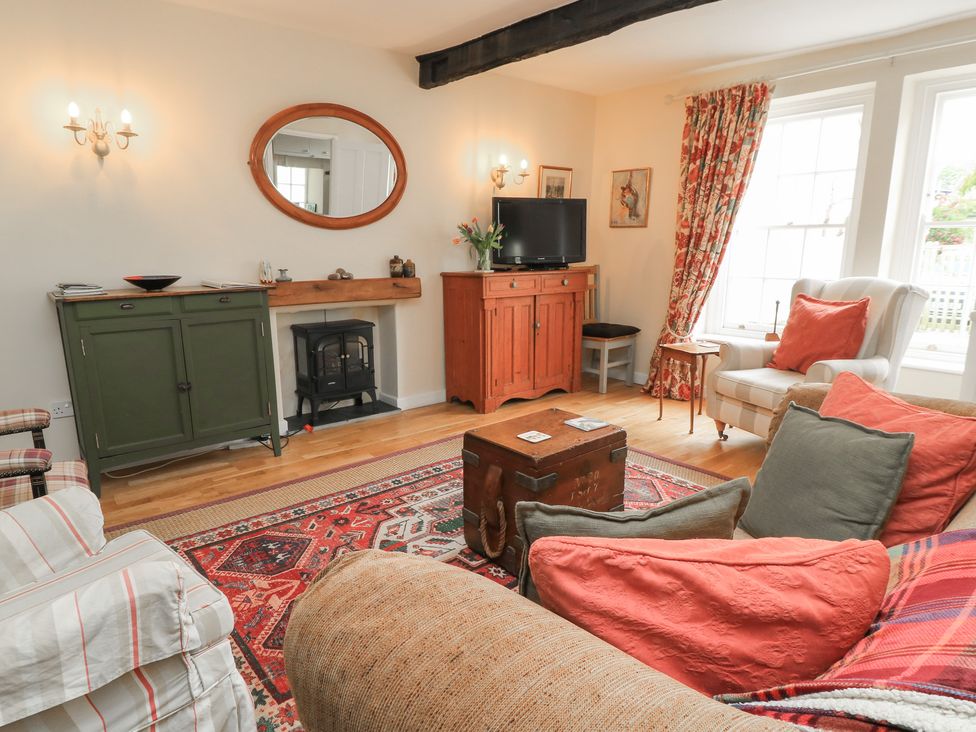 A living room with a sofa and coffee table at 4 Duck Street in Dorchester