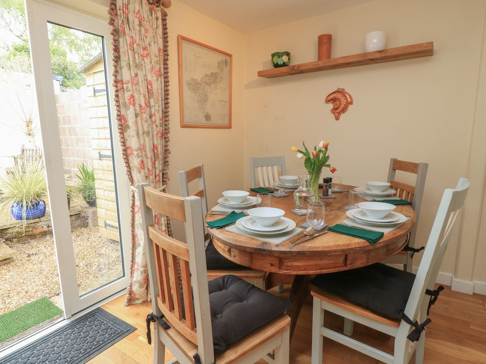A dining room with a round table and chairs at 4 Duck Street Dorchester