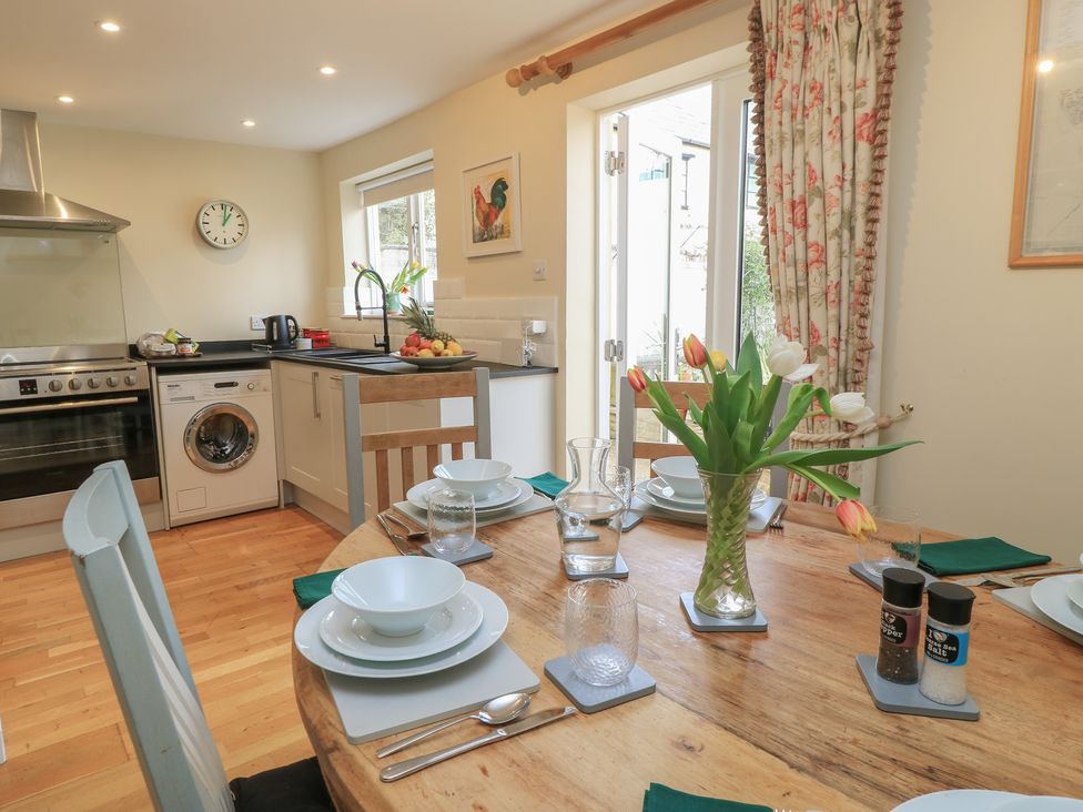 A kitchen with table set for dining at 4 Duck Street Dorchester