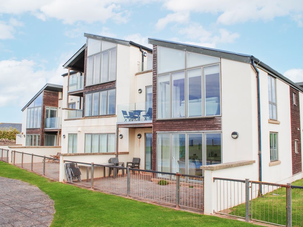 A building with multiple windows and balconies at 6 Ocean's Edge Thurlestone