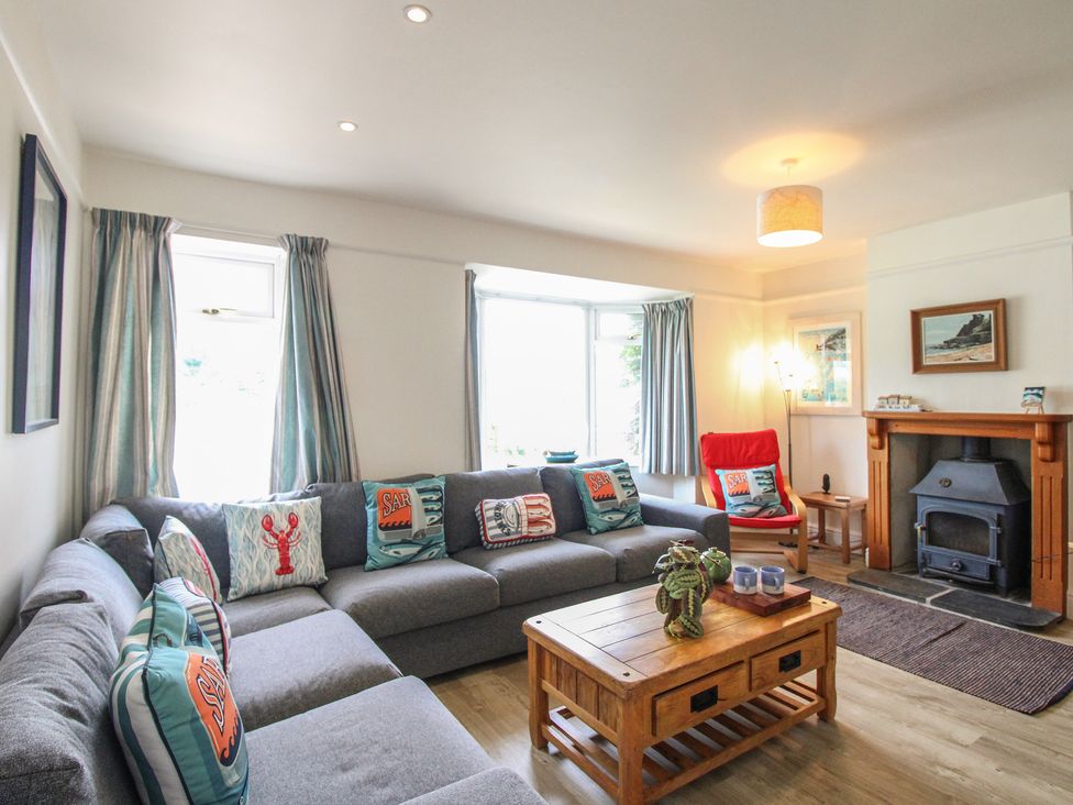 A living room with a sofa and coffee table at Home in Salcombe