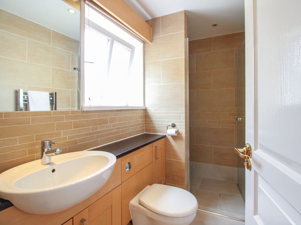A bathroom with a sink and toilet at Home in Salcombe