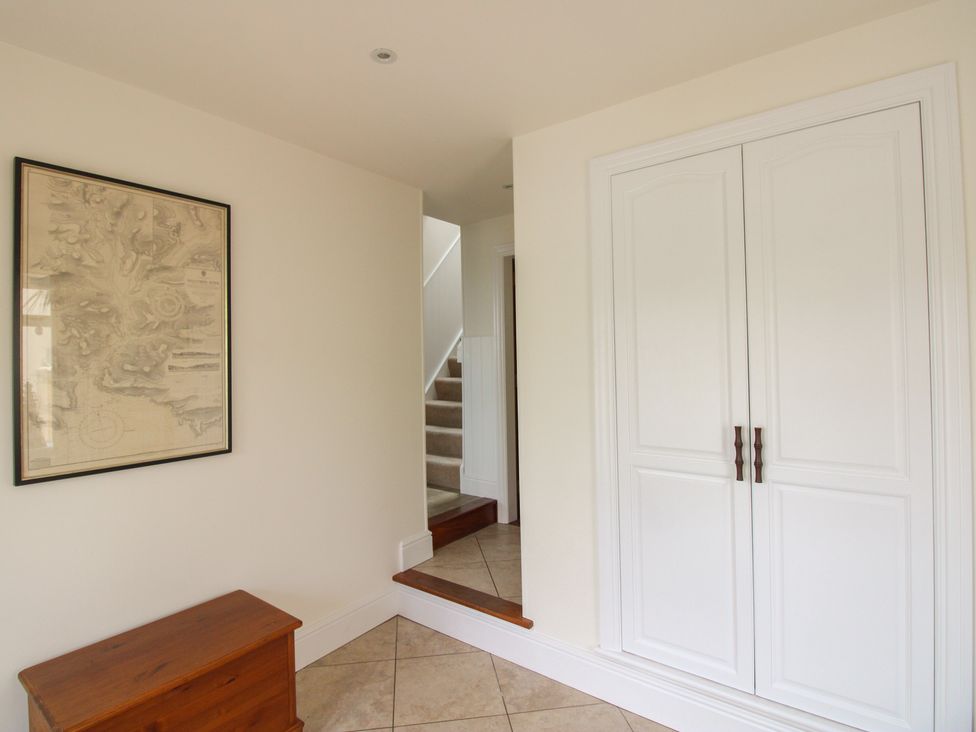 A hallway with a map on the wall at Home in Salcombe