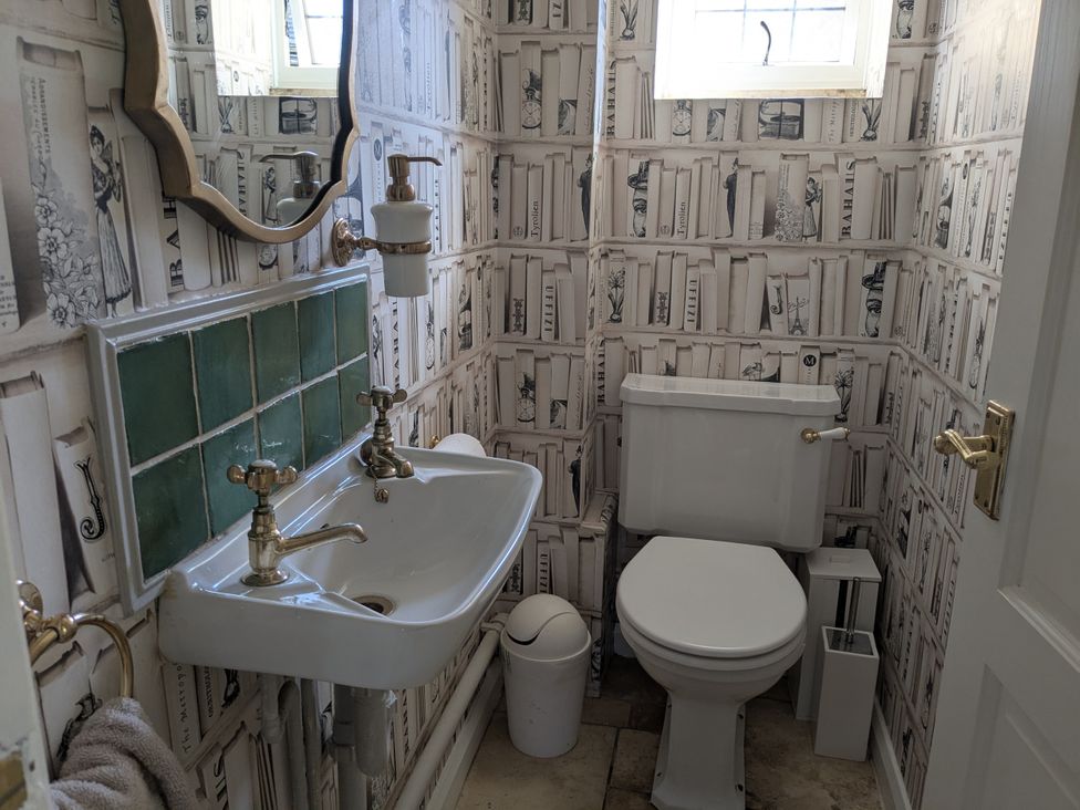 A bathroom with a sink and toilet at Mill Stream Cottage in Lower Slaughter near Bourton-On-The-Water