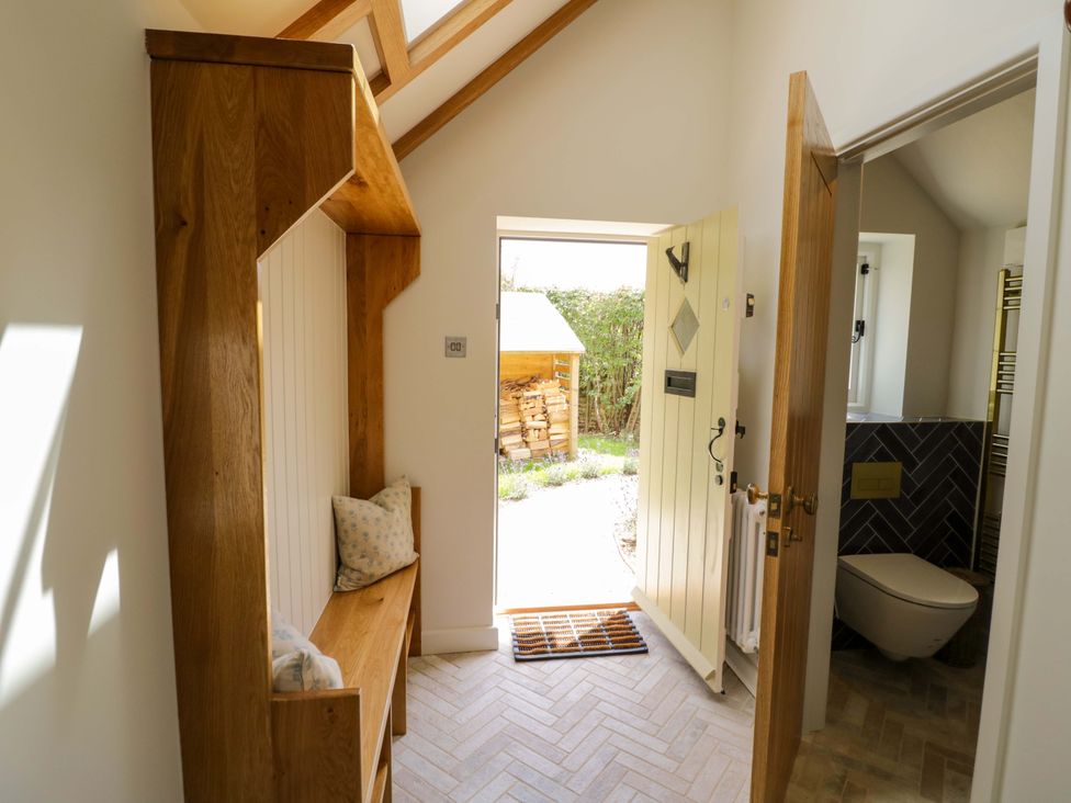 An entrance with a bench and an open door at Wyncliffe in Chipping Campden