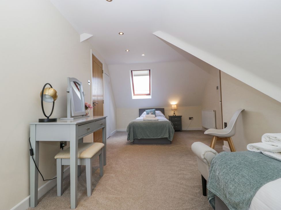 A bedroom with a bed and dresser at Bell Garden in Stow-On-The-Wold