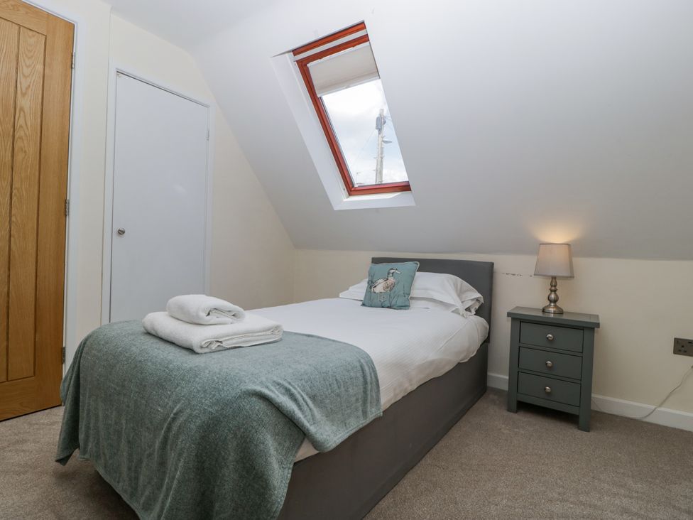 A bedroom with a bed and nightstand at Bell Garden, Stow-On-The-Wold